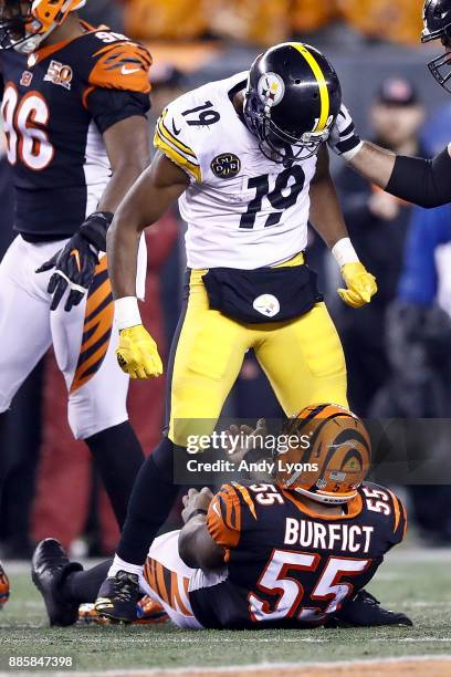 JuJu Smith-Schuster of the Pittsburgh Steelers stands over Vontaze Burfict of the Cincinnati Bengals after a hit during the second half at Paul Brown...