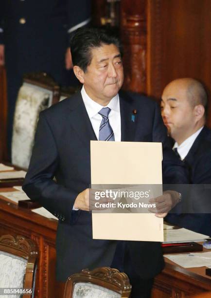 Japanese Prime Minister Shinzo Abe attends a House of Representatives plenary session in Tokyo on Dec. 5, 2017. The lower house adopted a resolution...