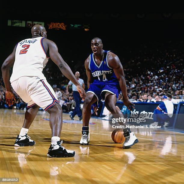 Anthony Mason of the Charlotte Hornets dribbles against Larry Johnson of the New York Knicks in Game One of the Eastern Conference Quarterfinals...