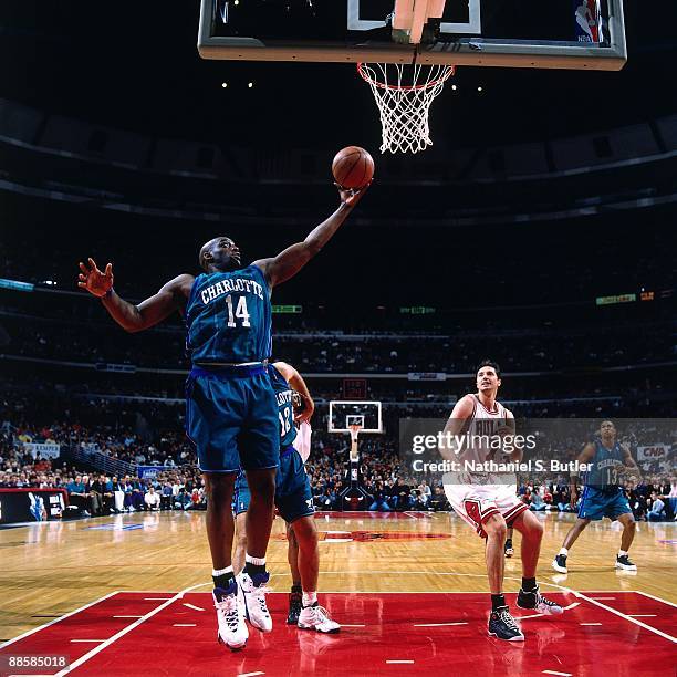 Anthony Mason of the Charlotte Hornets grabs a rebound in Game One of the Eastern Conference Semifinals against the Chicago Bulls during the 1998 NBA...