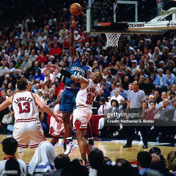 Anthony Mason of the Charlotte Hornets shoots over Dennis Rodman of the Chicago Bulls in Game Five of the Eastern Conference Semifinals during the...