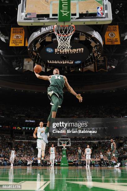 Giannis Antetokounmpo of the Milwaukee Bucks goes to the basket against the Boston Celtics on December 4, 2017 at the TD Garden in Boston,...