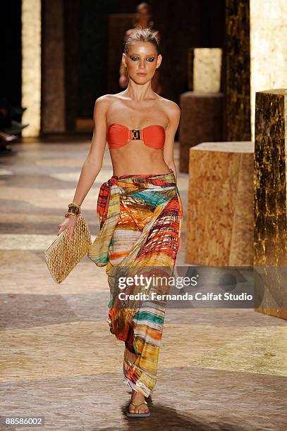 Model displays a design by Agua de Coco by Liana Thomaz during the third day of the Sao Paulo Fashion Week Spring - Summer 2010 collection at the...