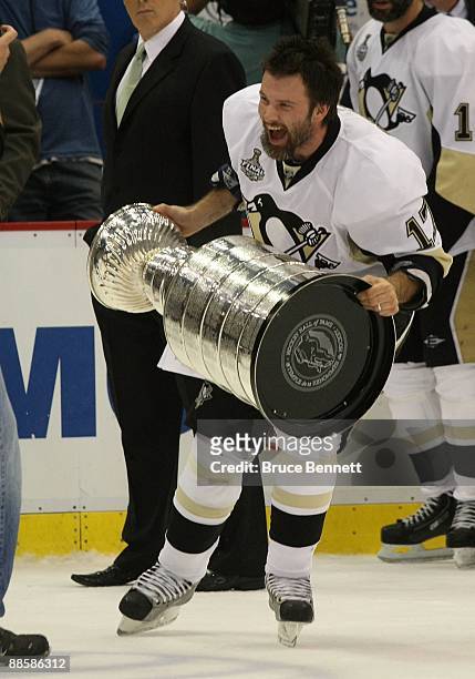 Petr Sykora of the Pittsburgh Penguins holds the Stanley Cup following the Penguins victory over the Detroit Red Wings in Game Seven of the 2009 NHL...