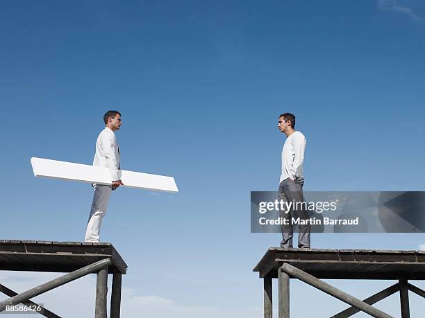 men bridging gap - bridging the gap stock pictures, royalty-free photos & images