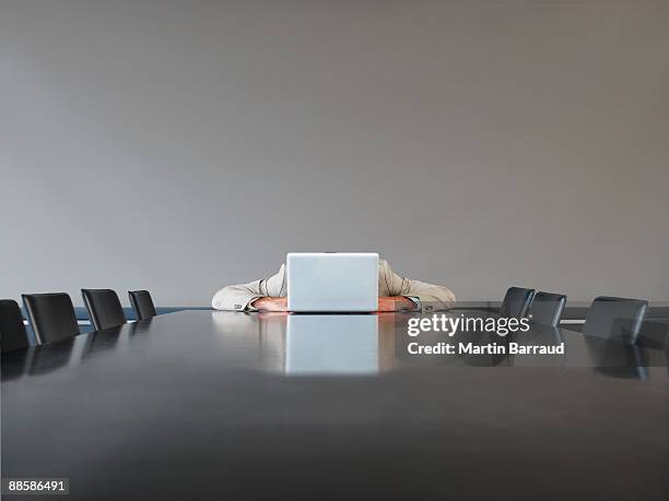 businessman with head on laptop - communication failure stock pictures, royalty-free photos & images