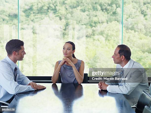 businesspeople meeting in conference room - female with group of males stock pictures, royalty-free photos & images