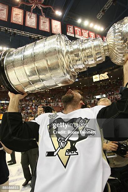 Petr Sykora of the Pittsburgh Penguins holds the Stanley Cup following the Penguins victory over the Detroit Red Wings in Game Seven of the 2009 NHL...