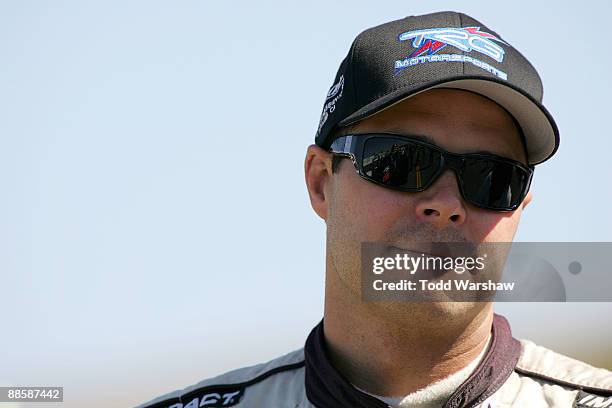 David Gilliland, driver of the Adobe Road Winery Chevrolet, looks on during qualifying for the NASCAR Sprint Cup Series Toyota/Save Mart 350 at the...