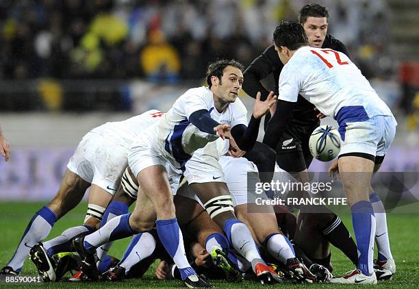 France's scrum-half Julien Dupuy passes the ball during their rugby union Test match against the New Zealand All Blacks on June 20, 2009 at the...