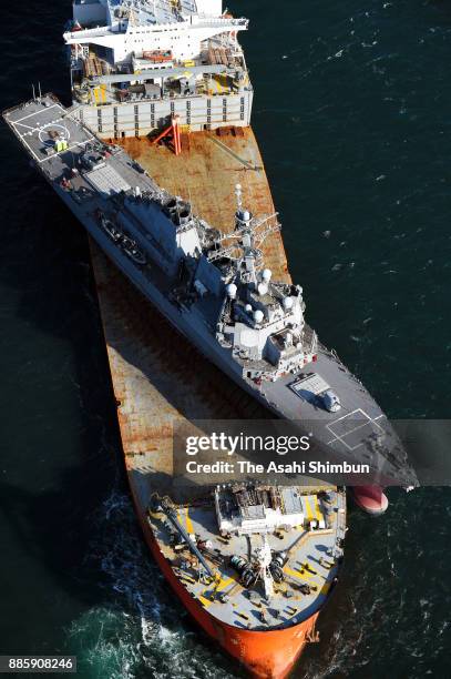 In this aerial image, USS John S. McCain loaded on Heavy Load Carrier arrives on December 5, 2017 in Yokosuka, Kanagawa, Japan. The destroyer...