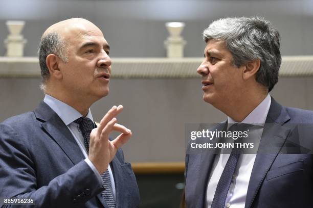 European Commissioner for Economic and Financial Affairs, Taxation and Customs Pierre Moscovici talks with new head of the Eurogroup Portuguese...