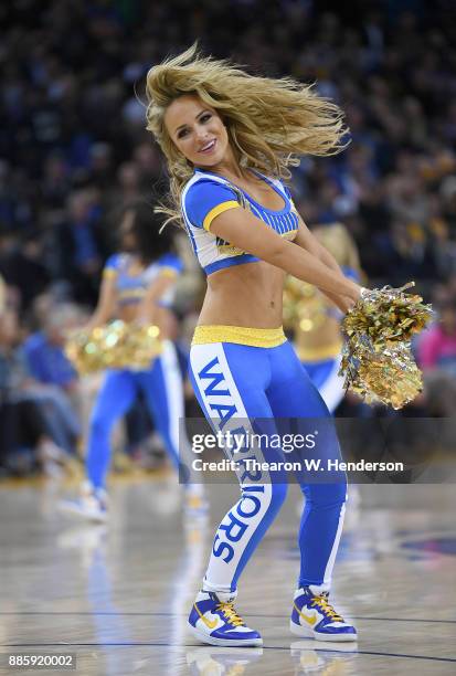 The Golden State Warriors Dance Team performs during an NBA basketball game against the Sacramento Kings at ORACLE Arena on November 27, 2017 in...