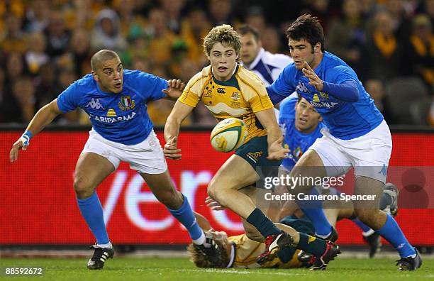 James O'Connor of the Wallabies passes the ball during the Second Test match between the Australian Wallabies and Italy at Etihad Stadium on June 20,...