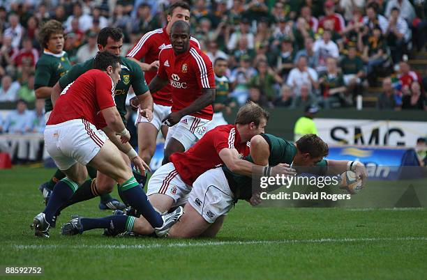 John Smit, the Springboks captain dives over to score the first try during the First Test match between the South African Springboks and the British...