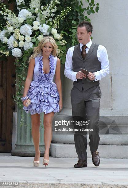 Chelsea and England captain John Terry and his wife Toni Poole Terry arrive for Joe Cole And Carly Zucker wedding at Royal Hospital Chelsea on June...