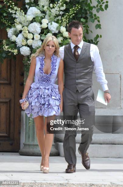 Chelsea and England captain John Terry and his wife Toni Poole Terry arrive for Joe Cole And Carly Zucker wedding at Royal Hospital Chelsea on June...