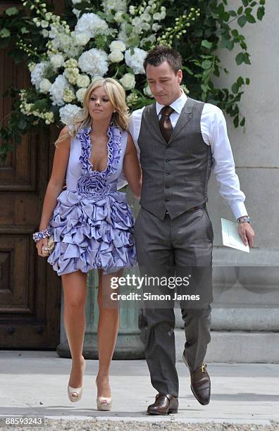 Chelsea and England captain John Terry and his wife Toni Poole Terry arrive for Joe Cole And Carly Zucker wedding at Royal Hospital Chelsea on June...