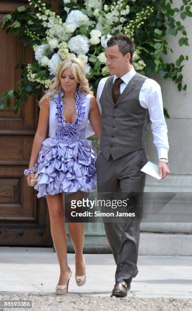 Chelsea and England captain John Terry and his wife Toni Poole Terry arrive for Joe Cole And Carly Zucker's wedding at the Royal Hospital Chelsea on...