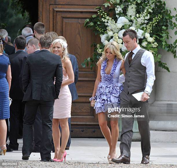 Chelsea and England captain John Terry and his wife Toni Poole Terry arrive for Joe Cole And Carly Zucker's wedding at the Royal Hospital Chelsea on...