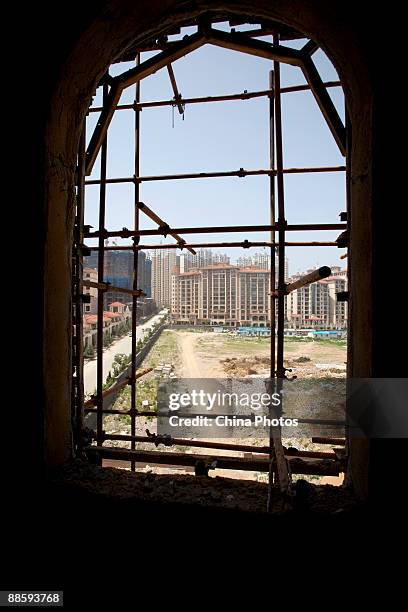 Construction continues at the Xiaopingdao June 20, 2009 in Dalian of Liaoning Province, China. Dalian Shengdao Real Estate Development Company gained...