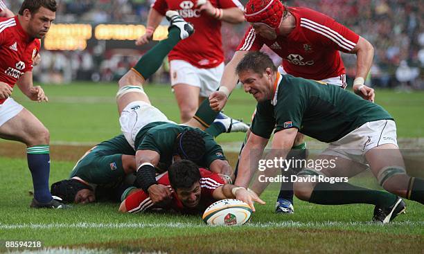 Mike Phillips of the Lions drops the ball just short of the try line during the First Test match between the South African Springboks and the British...