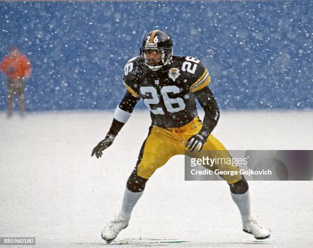 Cornerback Rod Woodson of the Pittsburgh Steelers looks on from the field as snow falls during a game against the Detroit Lions at Three Rivers...