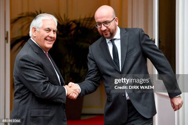 Belgian Prime Minister Charles Michel greets US Secretary of State Rex Tillerson upon his arrival for their meeting in Brussels on December 5, 2017....