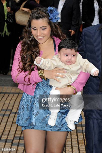 Gianina Maradona leaves the Nuestra Senora de Balvanera Church with her son Benjamin, after his christening, on June 20, 2009 in Buenos Aires,...