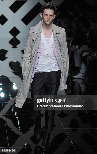 Model Tom Nicon walks the runway during the Burberry Fashion Show during Milan Fashion Week Menswear Spring/Summer 2010 on June 20, 2009 in Milan,...