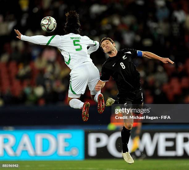 Nashat Akram of Iraq heads past Tim Brown of New Zealand during the FIFA Confederations Cup Group A match between Iraq and New Zealand at Ellis Park...