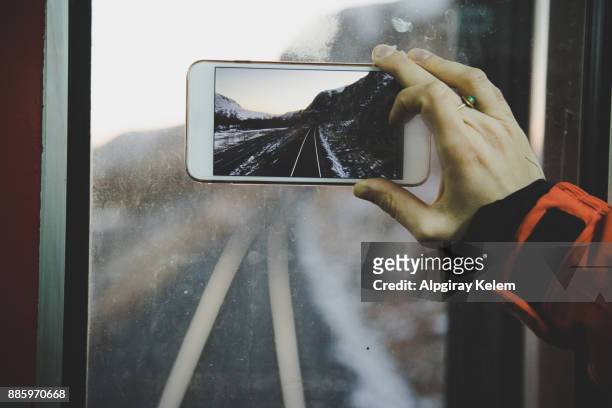 woman photographing view through smart phone - orient express stock pictures, royalty-free photos & images