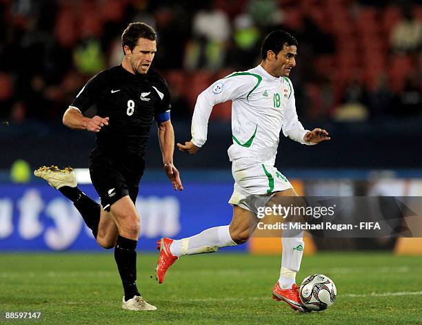 Mahdi Kareem of Iraq goes past Tim Brown of New Zealand during the FIFA Confederations Cup Group A match between Iraq and New Zealand at Ellis Park...