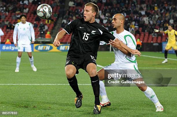 Jeremy Brockie of New Zealand is tackled by Basim Abbas of Iraq during the 2009 Confederations Cup match between Iraq and New Zealand from Ellis Park...