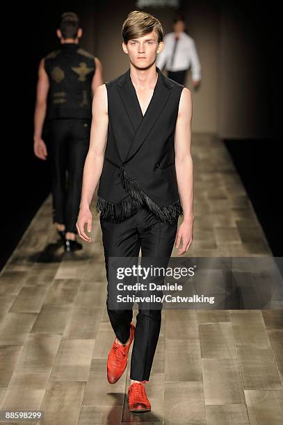 Model walks the runway during the Trussardi 1911 fashion show at Milan Fashion Week Menswear Spring/Summer 2010 on June 20, 2009 in Milan, Italy.