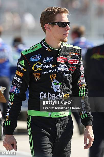Brad Keselowski, driver of the GoDaddy.com Chevrolet, walks to his car before qualifying for the NASCAR Nationwide Series NorthernTool.com 250 on...