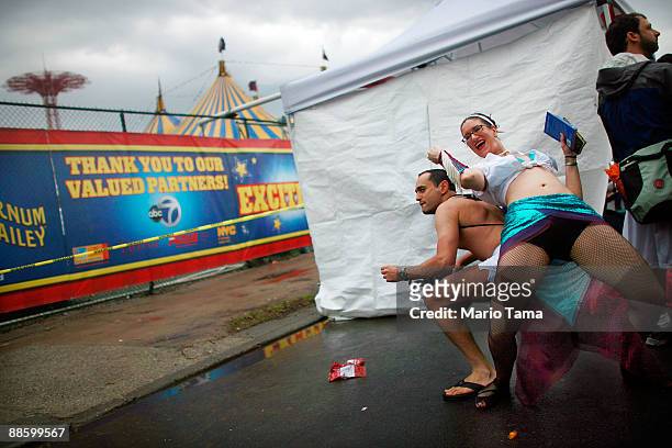 Performers dance before the start of the 2009 Mermaid Parade at Coney Island June 20, 2009 in the Brooklyn borough of New York City. Actor Harvey...