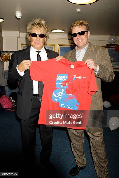 Rod Stewart and Suggs attend the Busking Cancer launch aboard the HMS Belfast on June 20, 2009 in London, England.