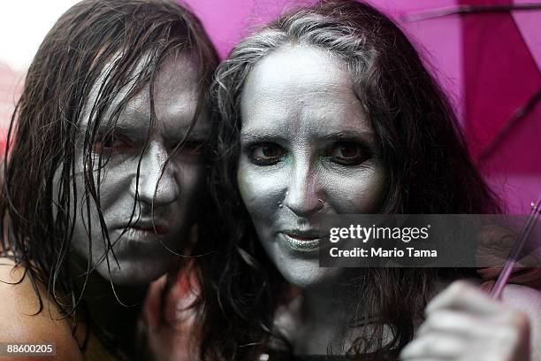 Siner and Luke Destefano look on before the start of the 2009 Mermaid Parade at Coney Island June 20, 2009 in the Brooklyn borough of New York City....