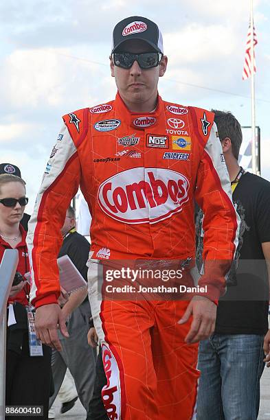 Kyle Busch, driver of the Combos Toyota, arrives at the reviewing stand for driver introductions before the NASCAR Nationwide Series NorthernTool.com...