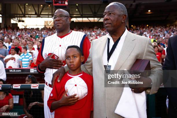 Baseball Hall of Famer Hank Aaron stands with Cincinnati Reds manager Dusty Baker and his 10-year-old son Darren prior to the Gillette Civil Right...