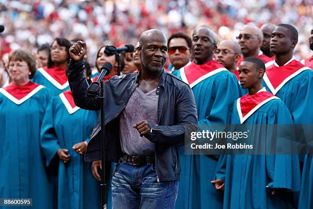 Grammy Award winning gospel singer BeBe Winans sings prior to the Gillette Civil Right Game between the Cincinnati Reds and Chicago White Sox at...