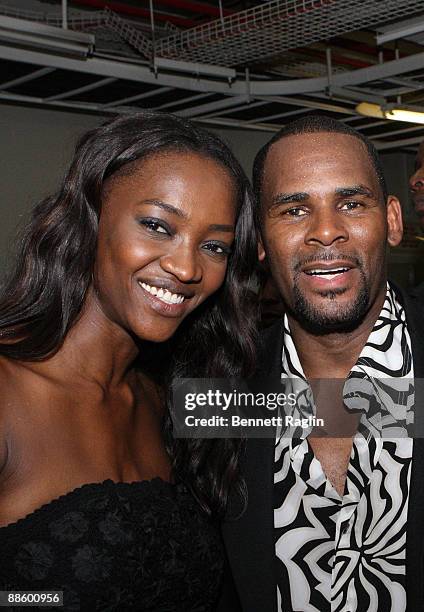 Model Oluchi and recording artist R. Kelly pose for a picture backstage at ARISE Africa Fashion Awards at Sandton Convention Center on June 20, 2009...