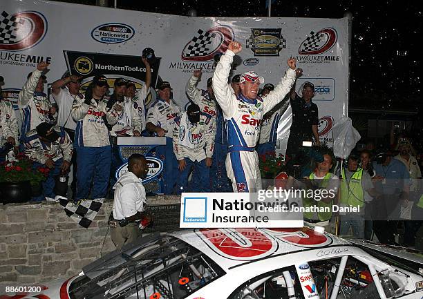 Carl Edwards, driving the Save-a-lot Ford, celebrates a win at the NASCAR Nationwide Series NorthernTool.com 250 on June 20, 2009 at the Milwaukee...