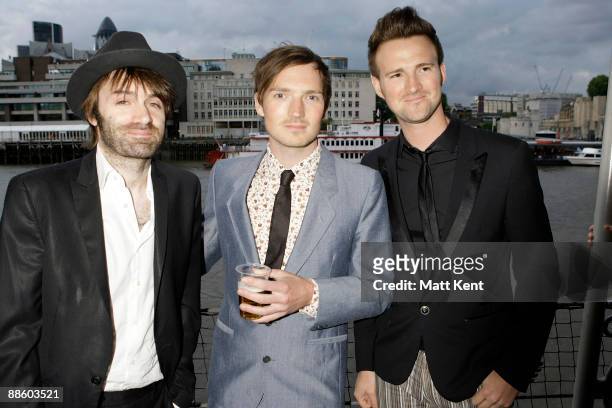 Ciaran Jeramiah, Dan Gillespie Sells and Paul Stewart of The Feeling attend Busking for Cancer at HMS Belfast on June 20, 2009 in London, England.