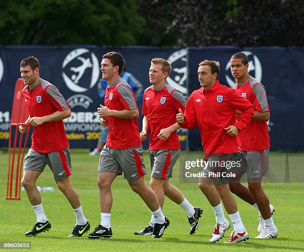 James Milner leads Craig Gardner, Mark Noble and Jack Rodwell of England during a Training session at the Ovrevi, on June 21, 2009 in Tvaaker,...