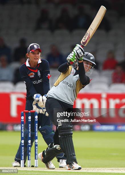 Amy Satterthwaite of New Zealand hits out watched by Sarah Taylor of England during the ICC Women's World Twenty20 Final between England and New...