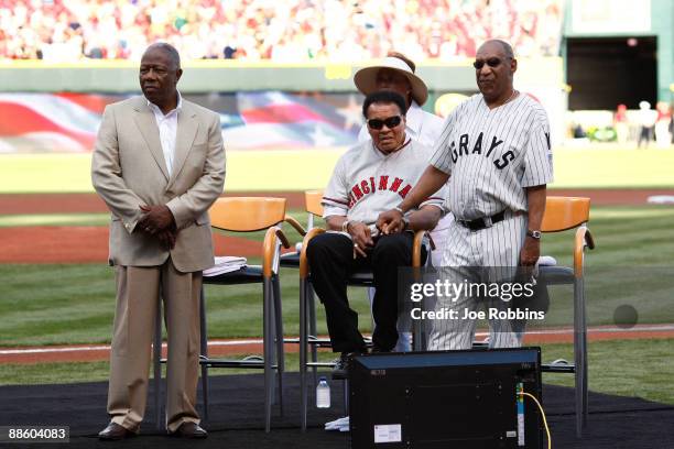 Major League Baseball Beacon Award recipients Hank Aaron, Muhammad Ali and Bill Cosby look on prior to the Gillette Civil Rights Game between the...