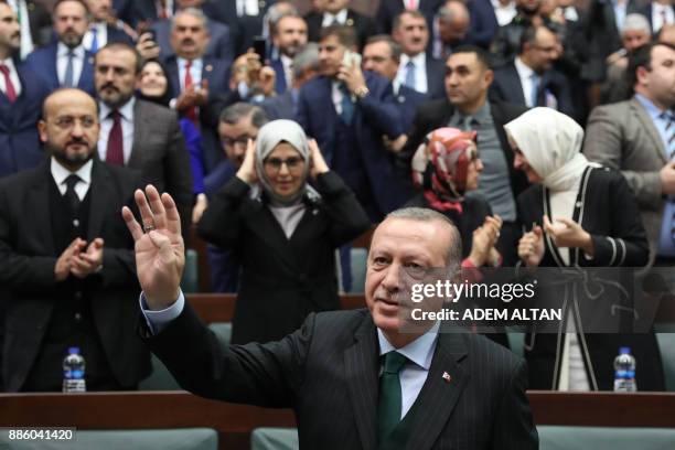 President of Turkey and Leader of the Justice and Development Party , Recep Tayyip Erdogan, waves after giving a speech during an AK party's group...