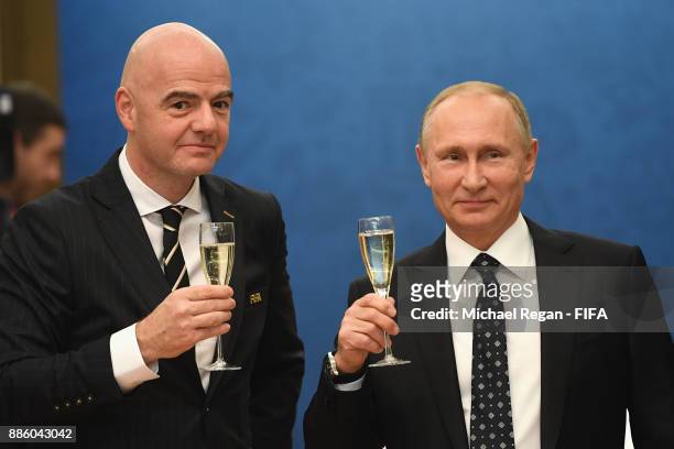 President, Gianni Infantino looks on with Vladimir Putin, President of Russia prior to the Final Draw for the 2018 FIFA World Cup Russia at the State...
